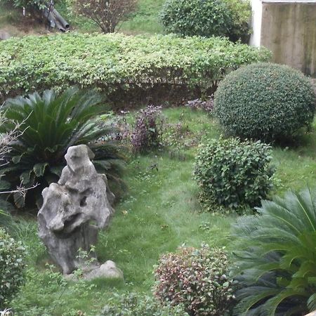 Xingfu Hotel Nanning Bagian luar foto