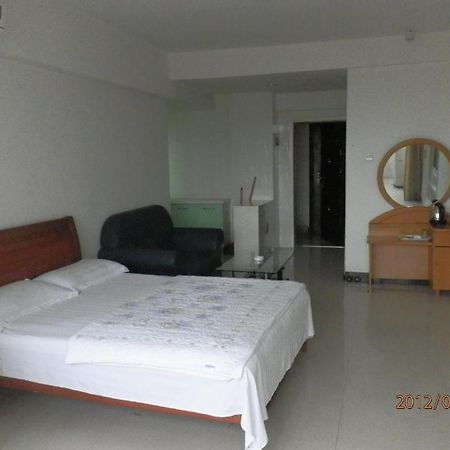 Xingfu Hotel Nanning Bagian luar foto