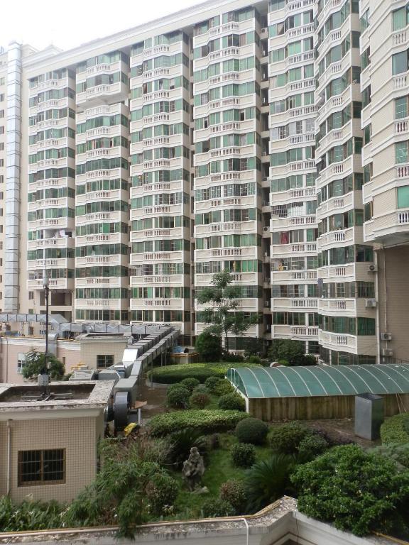 Xingfu Hotel Nanning Bagian luar foto