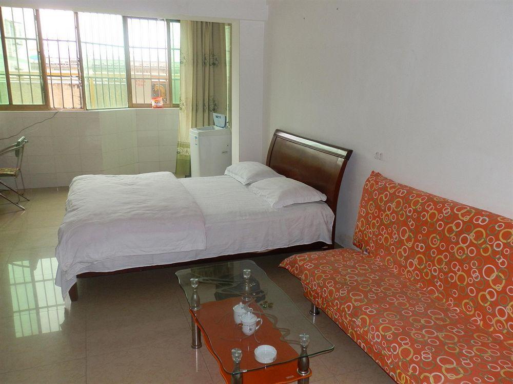 Xingfu Hotel Nanning Bagian luar foto