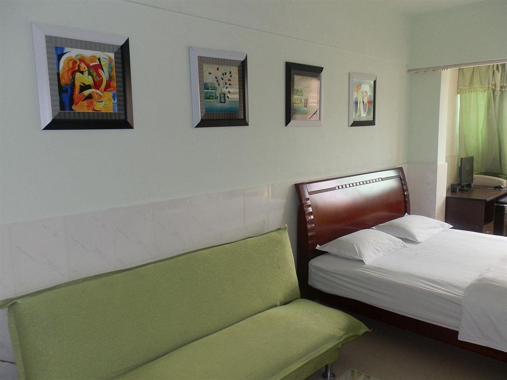 Xingfu Hotel Nanning Bagian luar foto