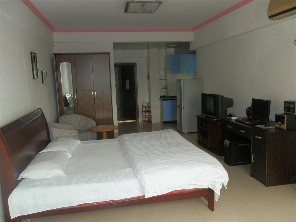 Xingfu Hotel Nanning Bagian luar foto