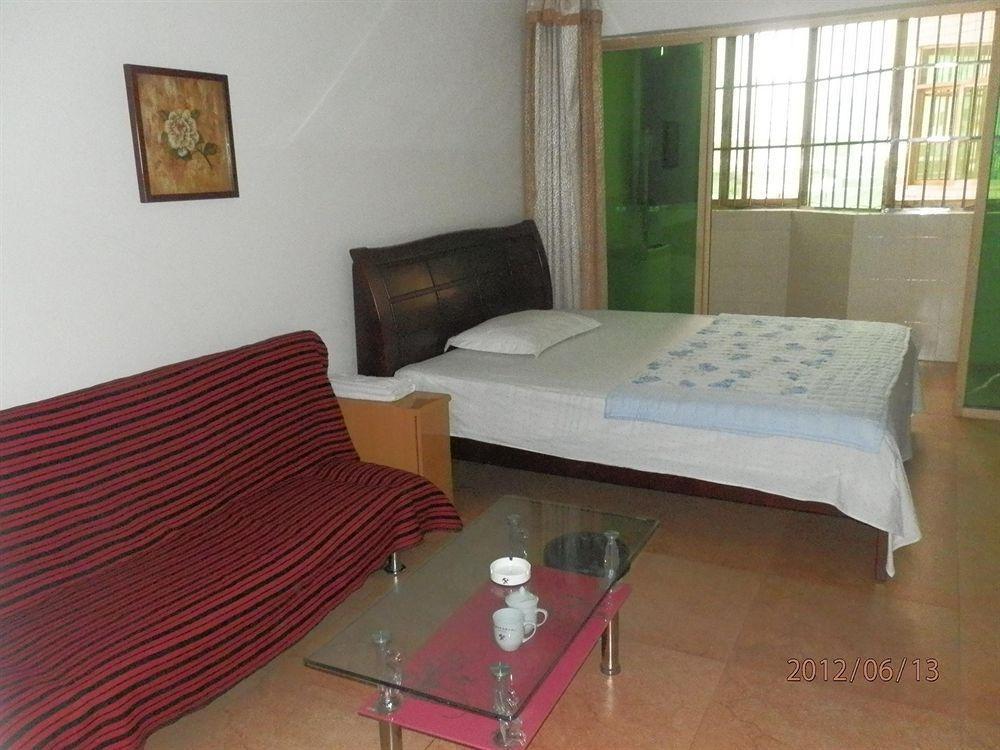 Xingfu Hotel Nanning Bagian luar foto