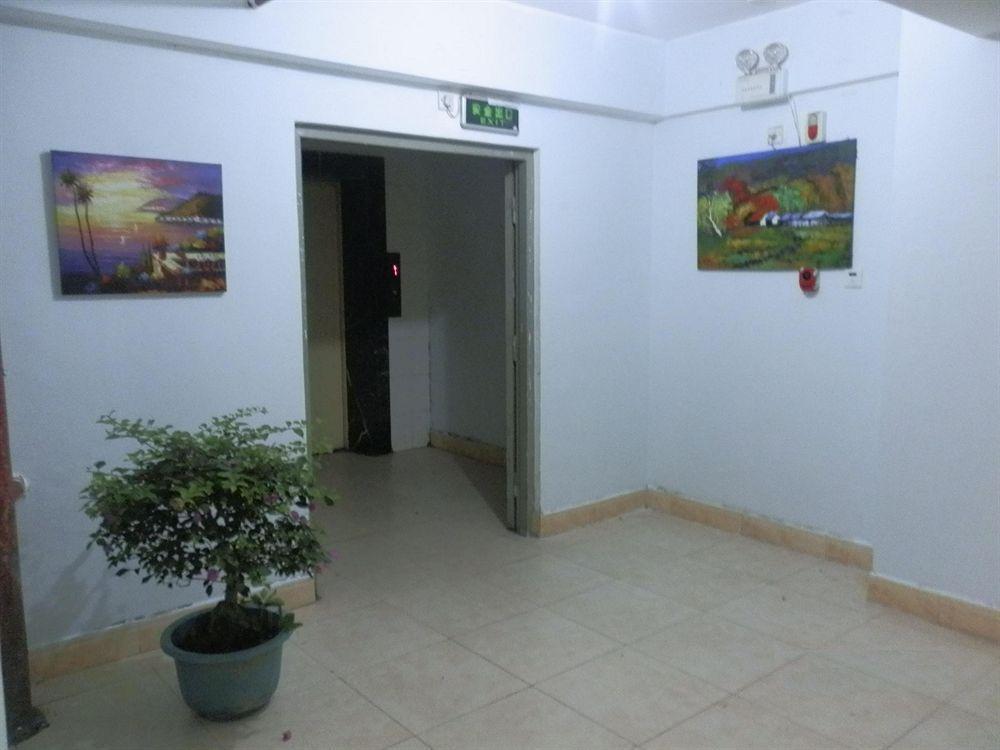 Xingfu Hotel Nanning Bagian luar foto