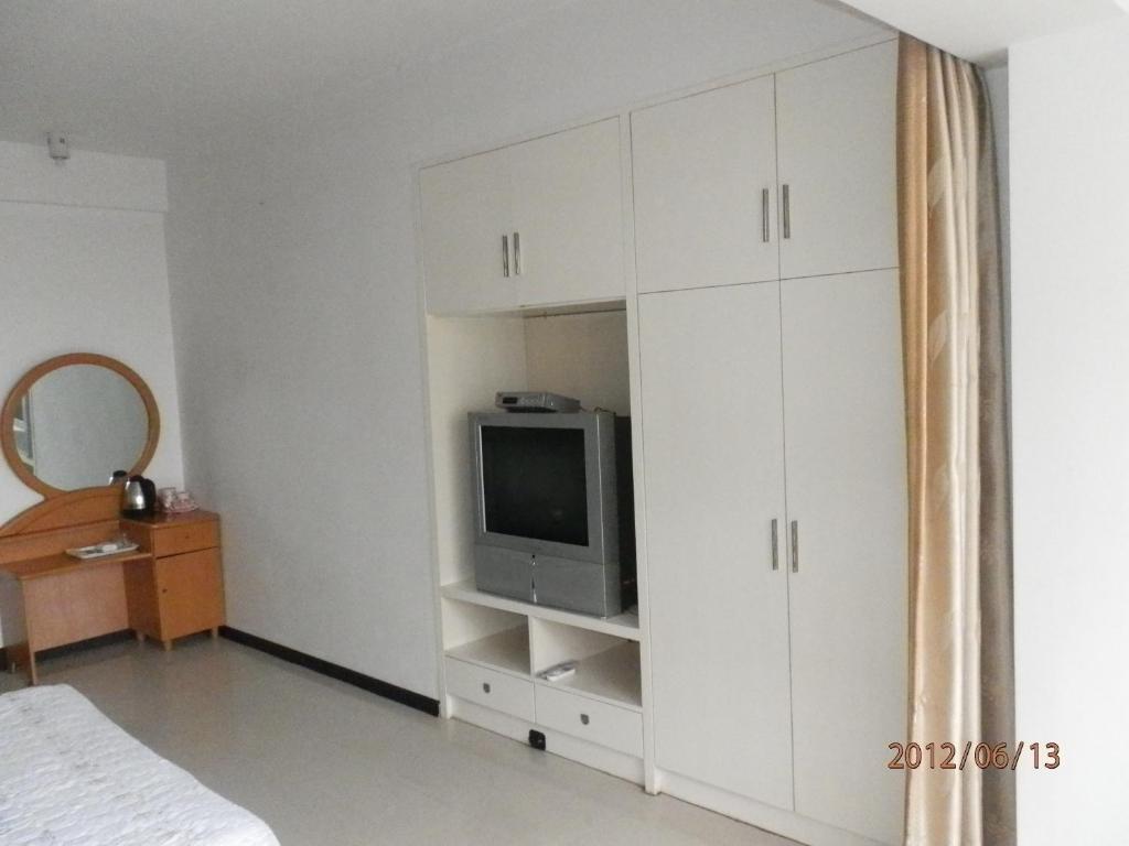 Xingfu Hotel Nanning Bagian luar foto